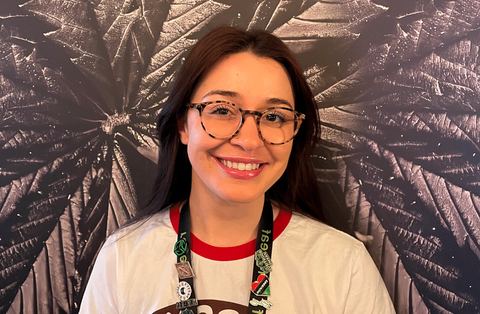 Julia Brito in front of the reLeaf leaf mural